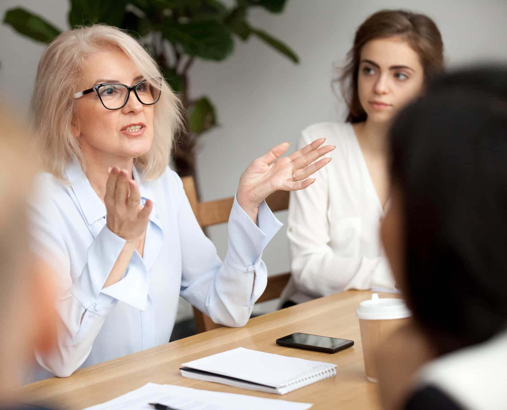 business woman speaking in a work meeting