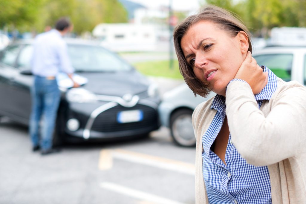 woman neck hurt after car crash on the street