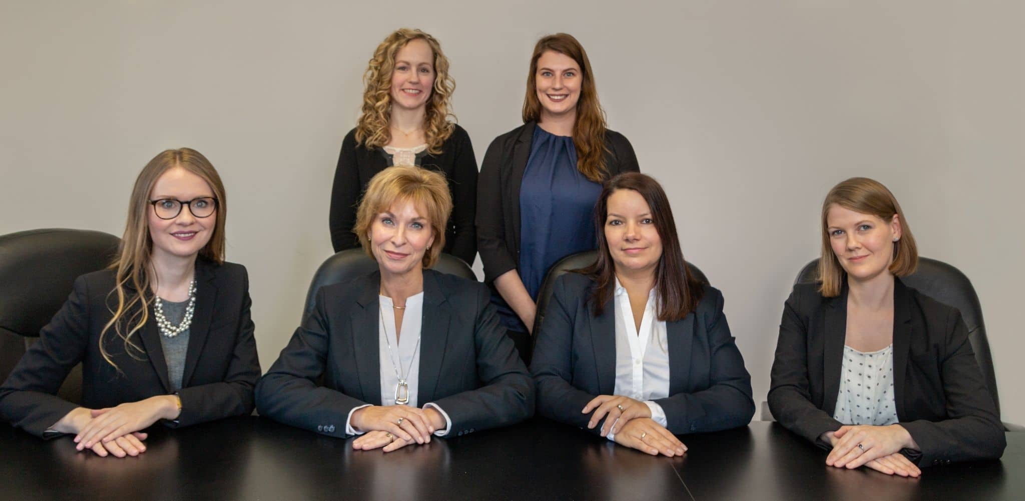 Group of female lawyers and staff smiling