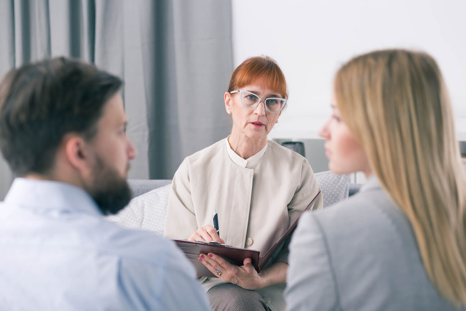 Mediator talking to a couple during a session